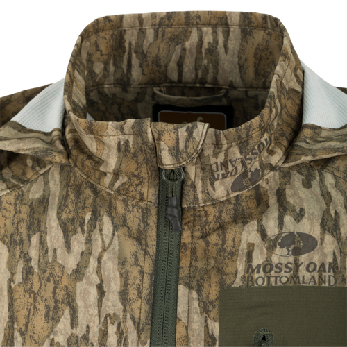 Rain Brake Lightweight Jacket close-up featuring a zipper and adjustable hood, designed for water resistance and comfort, ideal for hunting and outdoor activities.