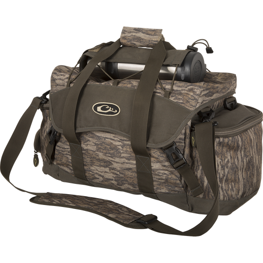 Floating Blind Bag 2.0 - Extra Large with camouflage pattern, featuring multiple pockets, adjustable strap, and waterproof liner for organized gear storage.