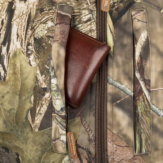 Close-up of the Camo Tech Vest with Agion Active XL, showcasing its chest pocket with a brown leather wallet partially visible.