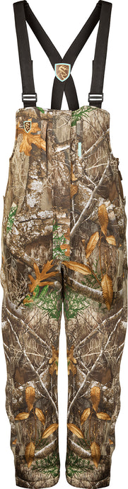 Women's Silencer Bib with Agion Active XL, featuring camouflage leaf pattern, vertical chest pockets, and Sherpa fleece lining for warmth and breathability.