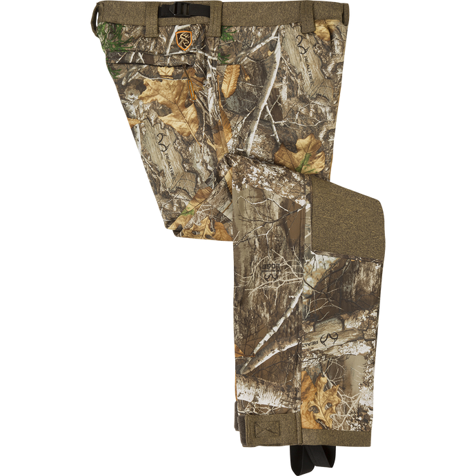 Youth Silencer Pant with Agion Active XL displayed folded, showcasing camouflage pattern and durable fabric with front slash and rear zippered pockets.
