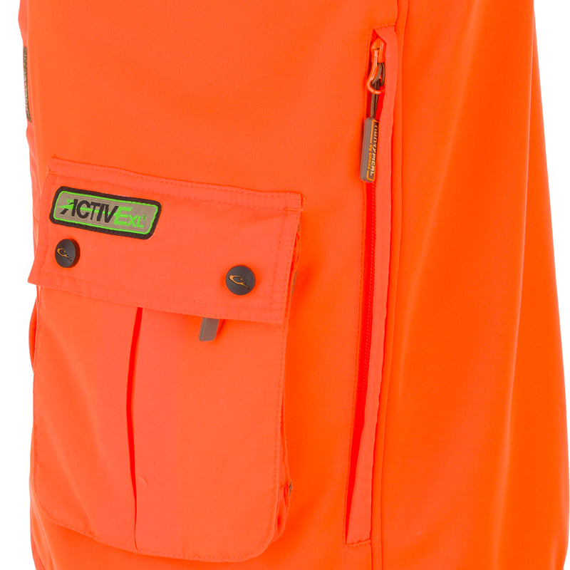 Blaze Orange Vest with Scent Control featuring chest pockets, zippered storage pockets, and fleece-lined hand-warmer pockets for enhanced functionality and comfort.