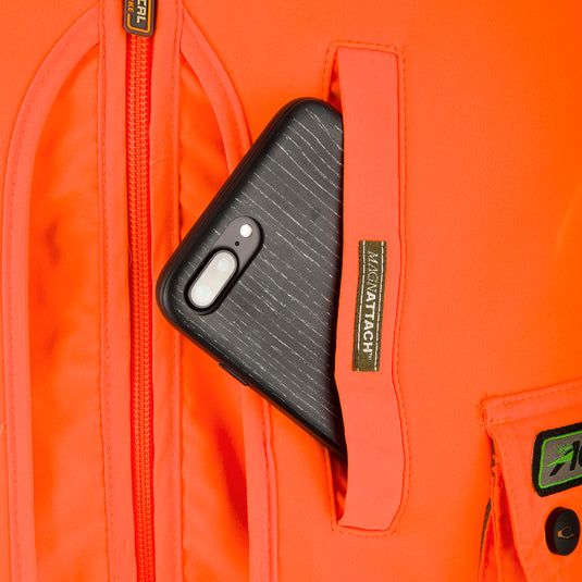 Blaze Orange Vest with Scent Control, featuring a cell phone in a backpack pocket, highlighting its practical storage options for outdoor activities.