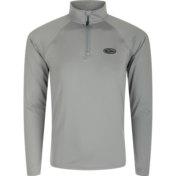 A grey long sleeved shirt with a zipper, part of the Microlite Performance 1/4 Zip Solid collection. Moisture-wicking, quick-drying, and odor-resistant, this lightweight shirt offers UPF sun protection and 4-way stretch. Perfect for outdoor activities.