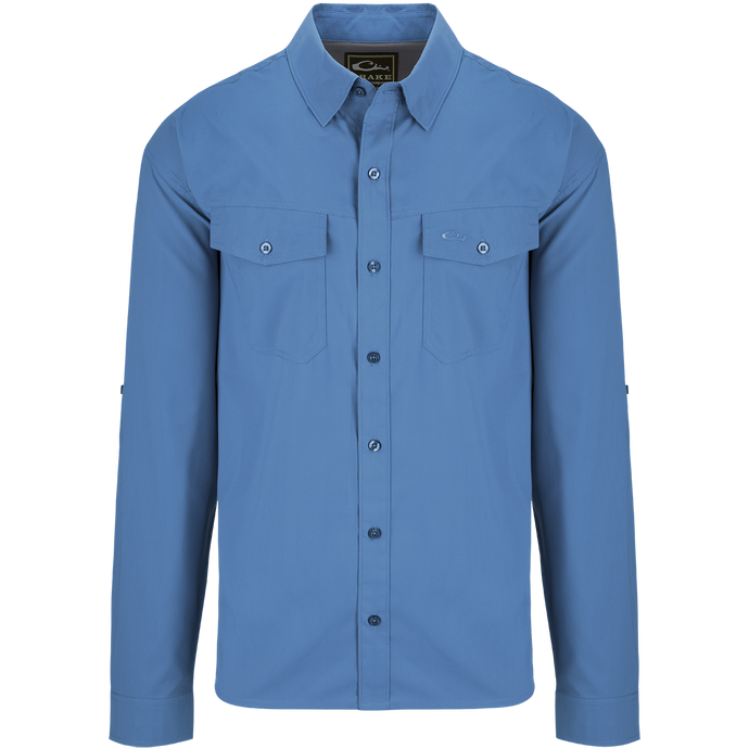 A blue dobby textured long sleeve shirt with hidden button-down collar, chest pockets, and split tail hem. Versatile for any season.