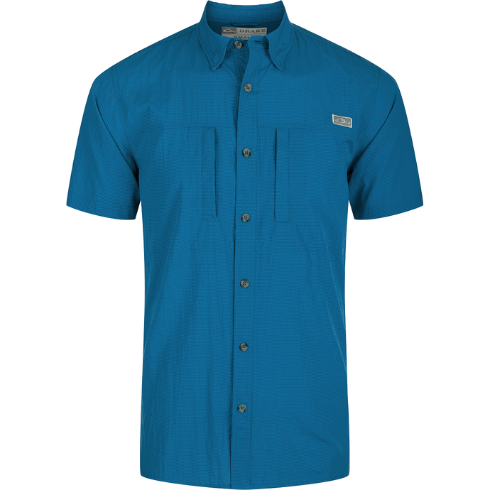 Classic Seersucker Minicheck Shirt: A button-down collar shirt with hidden zippered chest pocket and Magnattach closure. Vented cape back and split tail hem for added ventilation and versatile styling. Moisture-wicking, quick-drying fabric with UPF 30 sun protection.