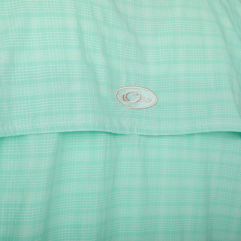 Close-up of the Wingshooter's Plaid Sun Shirt L/S, showcasing the green and white plaid fabric with UPF 50+ protection and front heat vents.