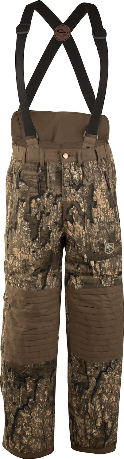 Guardian Elite™ High-Back Hunt Pant - Fleece-Lined camouflage shorts with reinforced knees, zippered pockets, and removable suspenders for cold-weather hunting. Final Sale, no returns or exchanges.