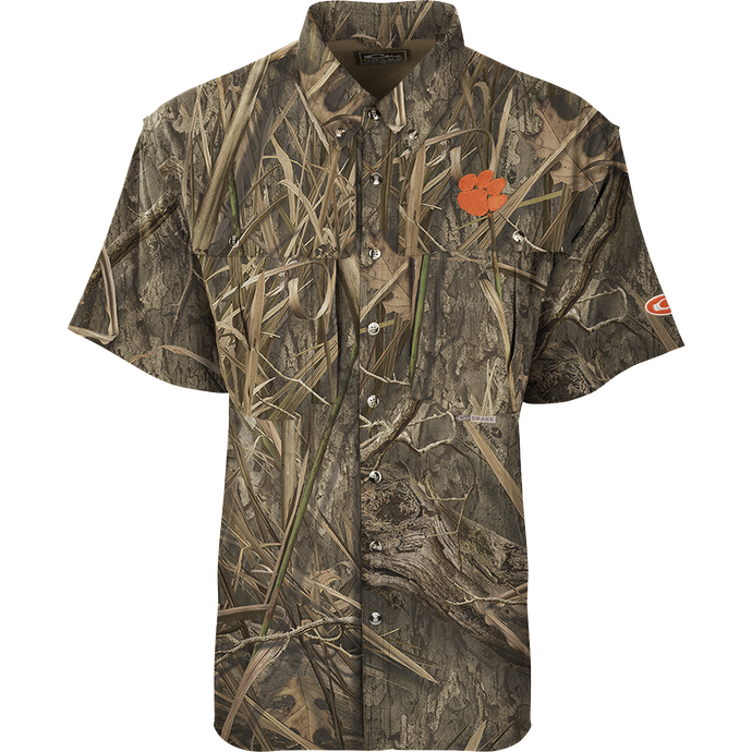 Clemson S/S Flyweight Wingshooter: Camouflage shirt with flower, lightweight polyester, vented back, moisture-wicking, UPF 50+, chest pockets, designed for warm-weather outdoor activities.