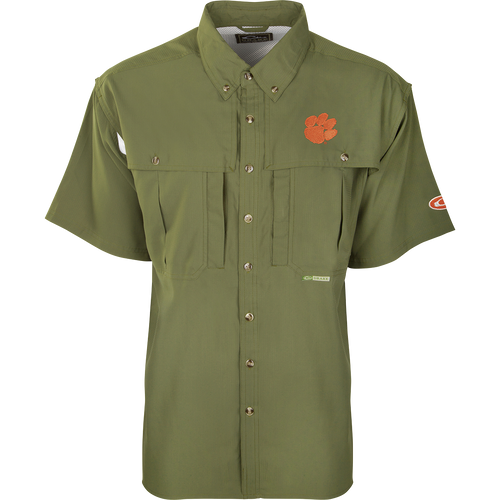 Clemson S/S Flyweight Wingshooter: Green shirt with vented back, quick-drying Flyweight polyester, UPF 50+ sun protection, Magnattach chest pocket, and vertical zipper pocket. Designed for warm-weather outdoor activities.