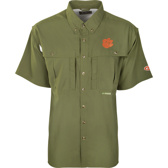 Clemson S/S Flyweight Wingshooter: Green shirt with vented back, quick-drying Flyweight polyester, UPF 50+ sun protection, Magnattach chest pocket, and vertical zipper pocket. Designed for warm-weather outdoor activities.