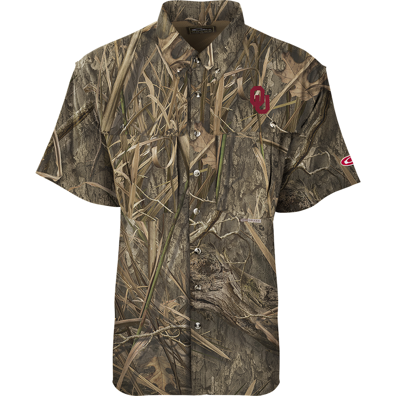 Oklahoma S/S Flyweight Wingshooter camouflage shirt with logo, featuring vented back, quick-drying fabric, UPF 50+ protection, and multiple functional pockets for warm-weather outdoor activities.